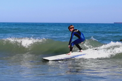 a man riding a wave on a surfboard in the ocean