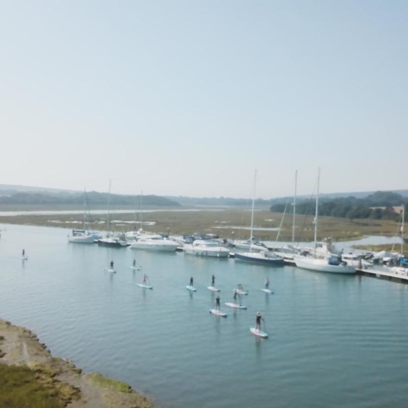 a boat is docked next to a body of water