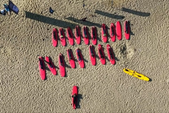 surfers having a land based lesson